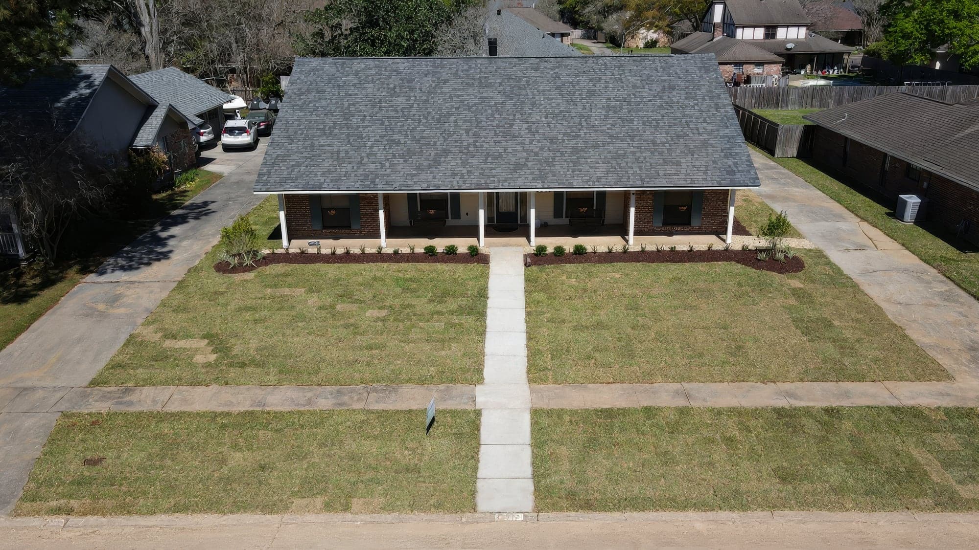 Aerial view of the same front yard with new sod installed